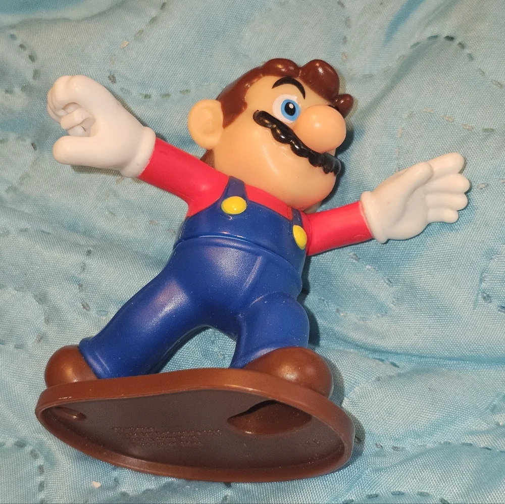 McDonald's Happy Meal toy featuring Mario from the Super Mario Bros. franchise.‎